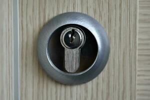 Keyhole close-up. The lock on the door. photo