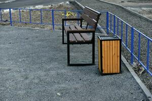 Benches and trash cans in the recreation park. Places to stay in the city. photo