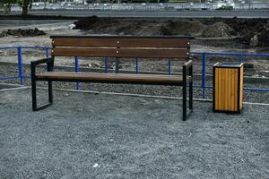 Benches and trash cans in the recreation park. Places to stay in the city. photo