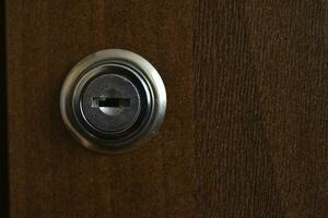 Keyhole close-up. The lock on the door. photo