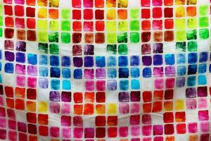 Detailed close up view on samples of cloth and fabrics in different colors found at a fabrics market photo