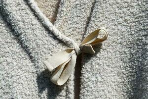 Detailed close up view on samples of cloth and fabrics in different colors found at a fabrics market photo