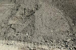 Sand and stones on a gravel ground texture in high resolution. photo