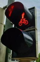 Green and red traffic lights for pedestrian and bicycles photo