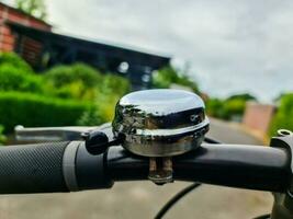 Close-up view of a bicycle bell on a handlebar. photo