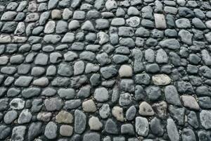 Background of an old cobblestone street in a historic old town. photo