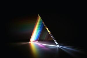 A prism dividing a lightbeam into the spectral colors created with technology. photo