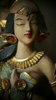 Beautiful artistic statue of a Balinese or javanese dancer used as garden decoration, javanese gnome indonesia photo