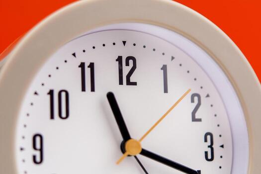 alarm clock time strategy Work plan with time. Orange background. Working with time. Punctuality. Keep time. Value time concept. photo