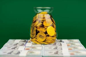 Gold in a jar and dollars Financial and investment success Salary Investment income Dividend Financial wealth photo
