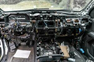 car interior without dashboard, repair after an accident photo