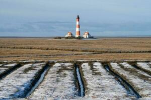 Lighthouse of Westerhever, North Frisia, Germany photo