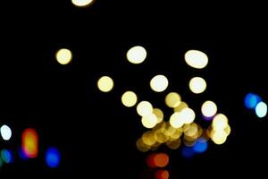 Bokeh light of street lamp at night, blurred background. photo