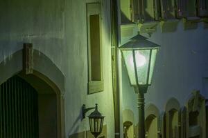 street lamp in the town in the night photo