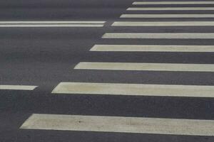asphalt road white paint markings of pedestrian crossing. photo