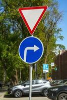 road signs move to right and give way. photo