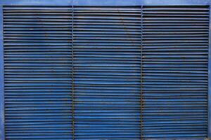 abstract background blue metal grille blinds stripes. photo