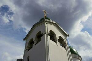 of Orthodox church, bottom view of green domes photo