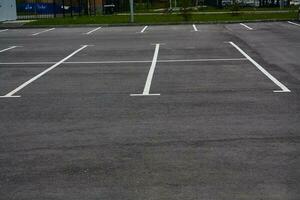 Photo of empty parking lot without cars.