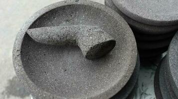 Traditional kitchenware named stone mortar and pestle photo