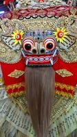 Frontal view of Barong, lion-like creature character in the mythology of Bali photo