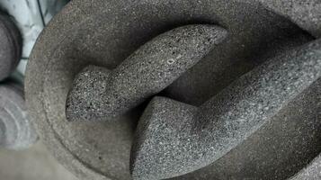 Traditional kitchenware named stone mortar and pestle photo