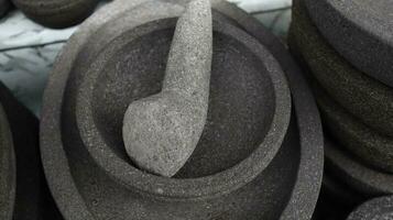 Traditional kitchenware named stone mortar and pestle photo