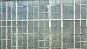 Wide glass checkered wall. Background video