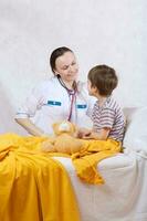 A child and a paediatrician in her cabinet photo