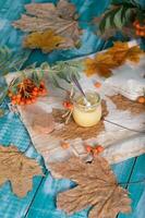 Rowan berries, glass with honey and honeycomb on a sackcloth. . photo