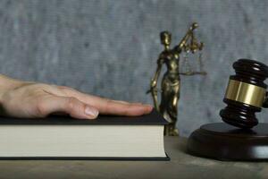 Witness's hand on a bible. Closeup photo