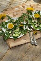 Dandelion salad on a white plate. photo