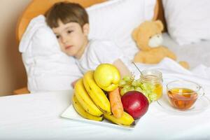 Fruits,hot tea,honey,on the table, photo