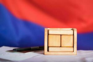 Wooden calendar with free text in front of Russian flag. photo