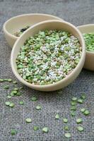 An assortment of legumes and cereals in a clay dish photo