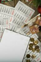 Blank sheet of paper and small purse with coins on the New Year's background. photo