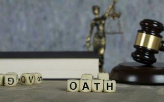 Word OATH composed of wooden letters. photo