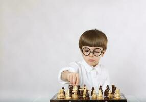 Boy is playing chess photo