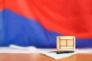 Wooden calendar with free text in front of Russian flag. photo