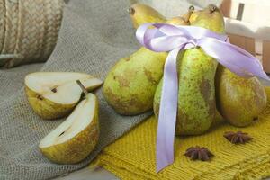 Green pears on a sackcloth photo