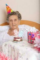 Old woman celebrates her birthday photo