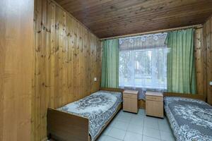 interior of wooden eco bedroom in studio apartments,  hostel or homestead photo