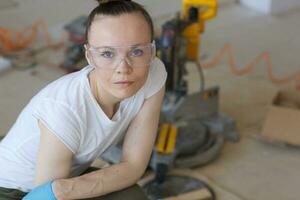 Young lady deals with wooden plinth photo