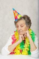 Old woman ready to celebrate an event photo