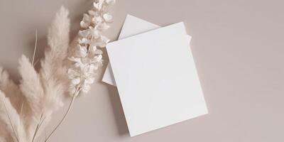 Mockup Paper Wedding Invitation Boho Minimal Style Greeting Card for Wedding Invitations and Birthday Stationery. Top View Flat Lay Copyspace. photo