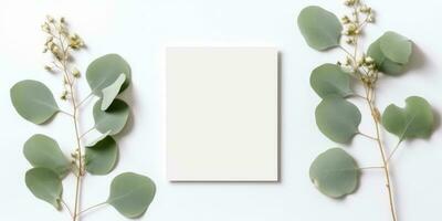 Minimalist Greeting Card Mockup with Delicate Dry Eucalyptus Leaves - Top View on a Clean White Background, AI Generated photo