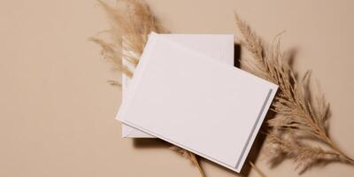 Mockup Paper Wedding Invitation Boho Minimal Style Greeting Card for Wedding Invitations and Birthday Stationery. Top View Flat Lay Copyspace. photo