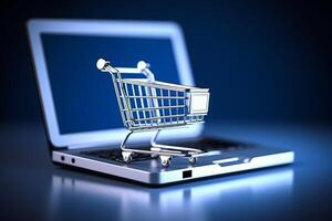 Cart laptop on blue background, online shopping concept, photo