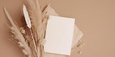 Mockup Paper Wedding Invitation Boho Minimal Style Greeting Card for Wedding Invitations and Birthday Stationery. Top View Flat Lay Copyspace. photo