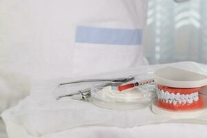 Sterile cotton napkins and stomatological tools on a table. Closeup photo